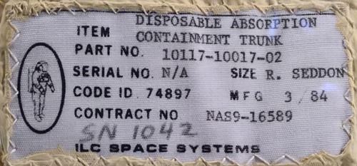 dettaglio etichetta cucita sul pannolone: Disposable Absorption Containment Trunk 